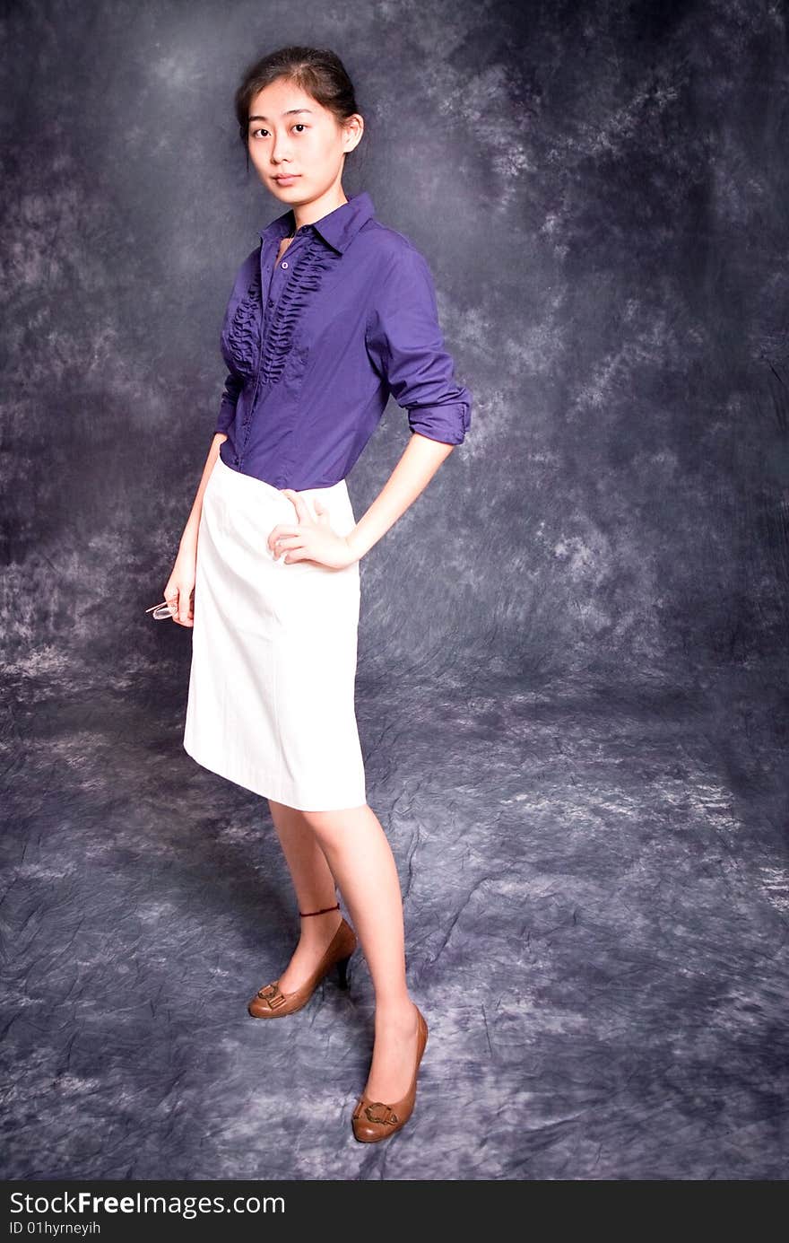 Chinese office lady in purple shirt and white skirt