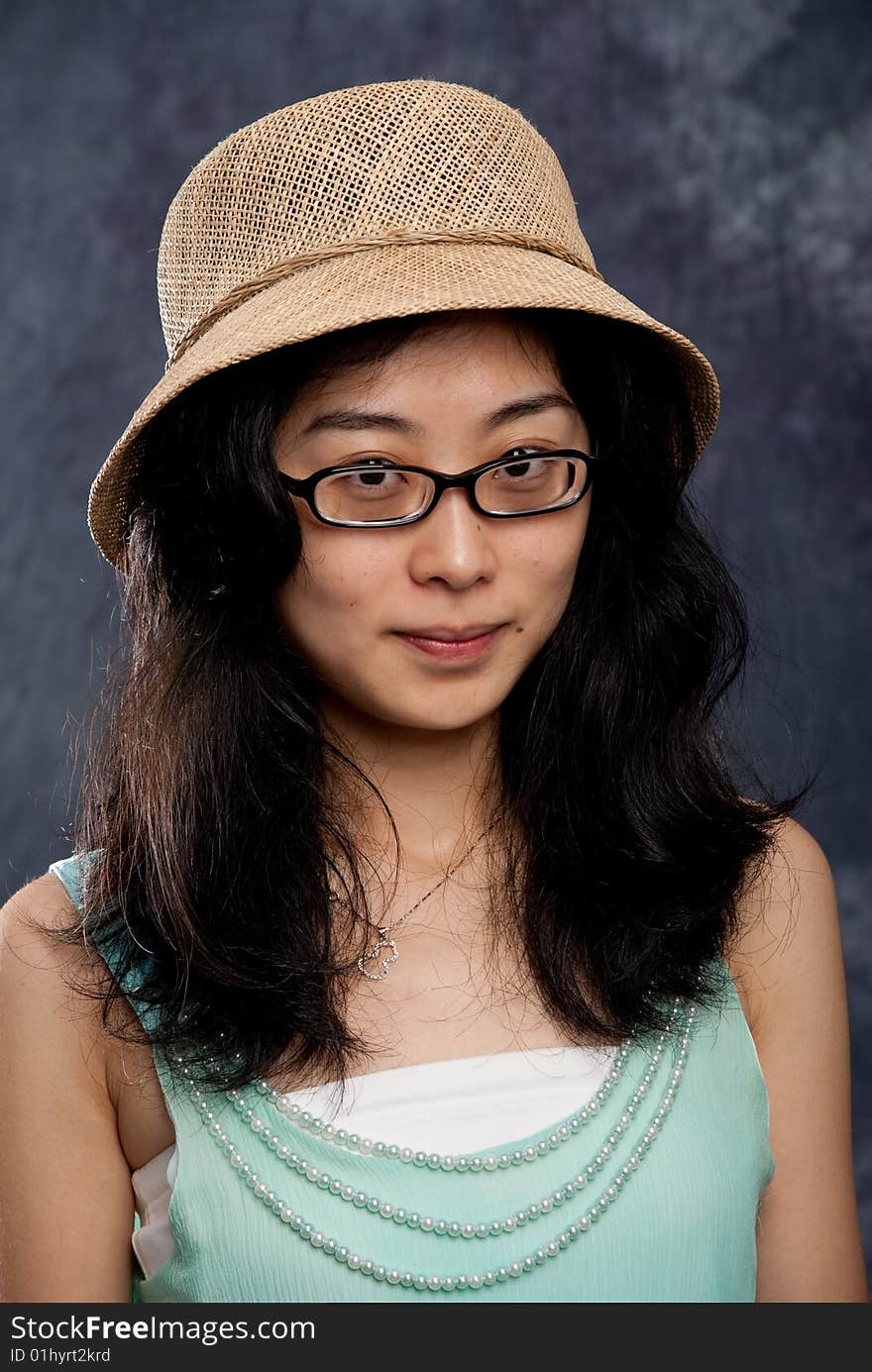 Chinese lady with hat and light green shirt. Chinese lady with hat and light green shirt