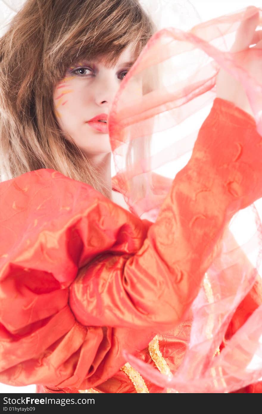 Cute teenage girl showing her orange fancy dress