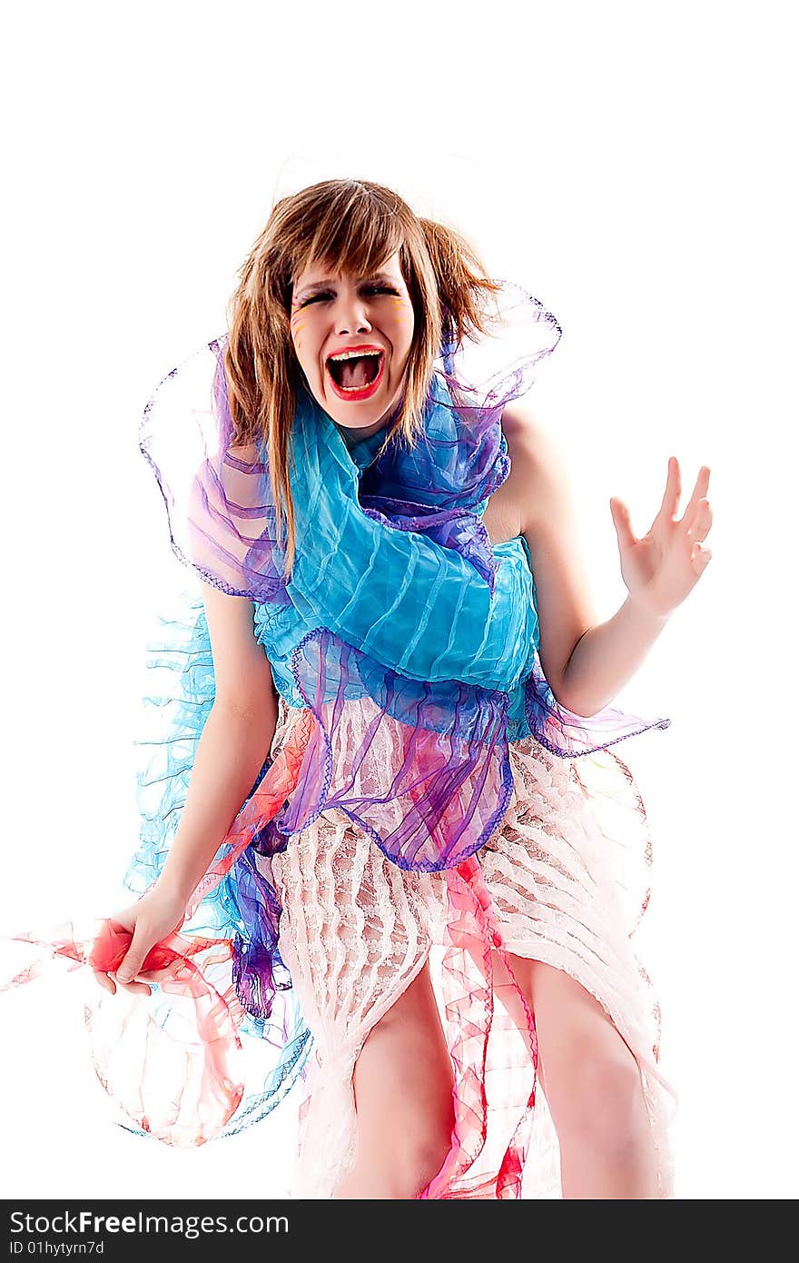 Studio portrait of a teenage girl in specially designed dress screaming. Studio portrait of a teenage girl in specially designed dress screaming