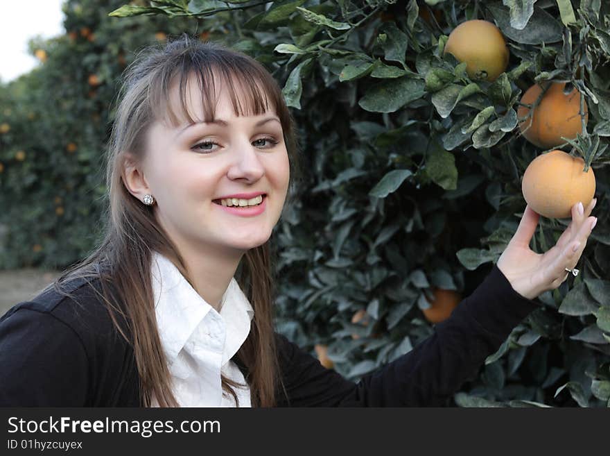 Portrait of smilind girl in a orchard. Portrait of smilind girl in a orchard