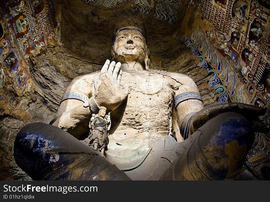 Yungang caves, Datong, China. Exterior view of the statues. Yungang caves, Datong, China. Exterior view of the statues.