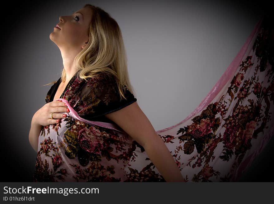 Side view of pregnant woman wearing stole