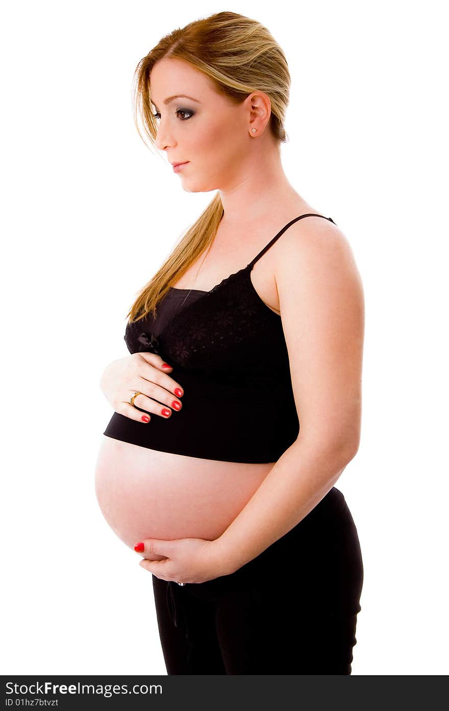 Pregnant female keeping hands on her tummy