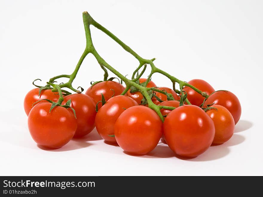 A group of red tomatoes on white background. A group of red tomatoes on white background