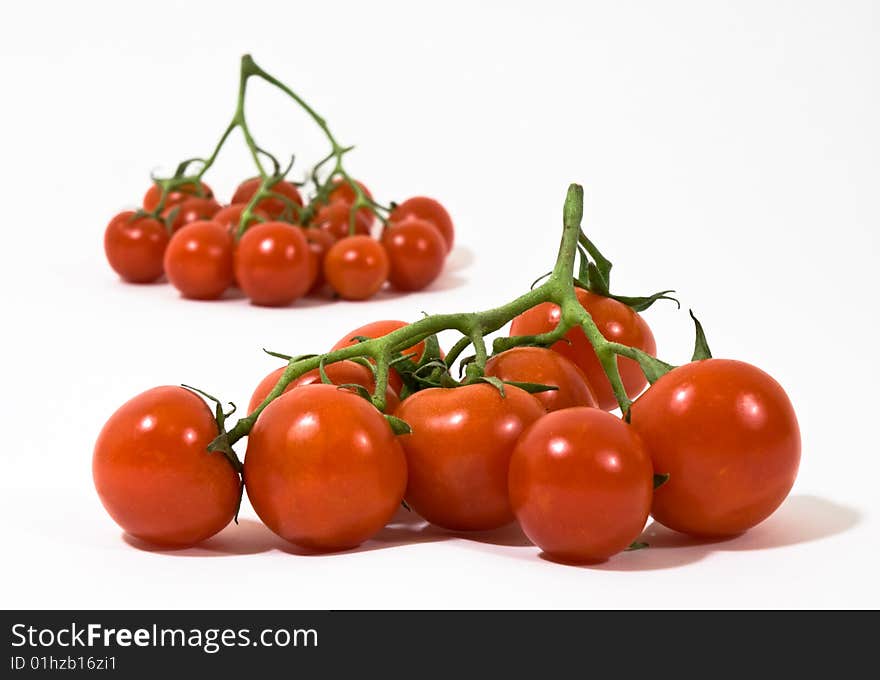 Groups of red tomatoes on white background. Groups of red tomatoes on white background