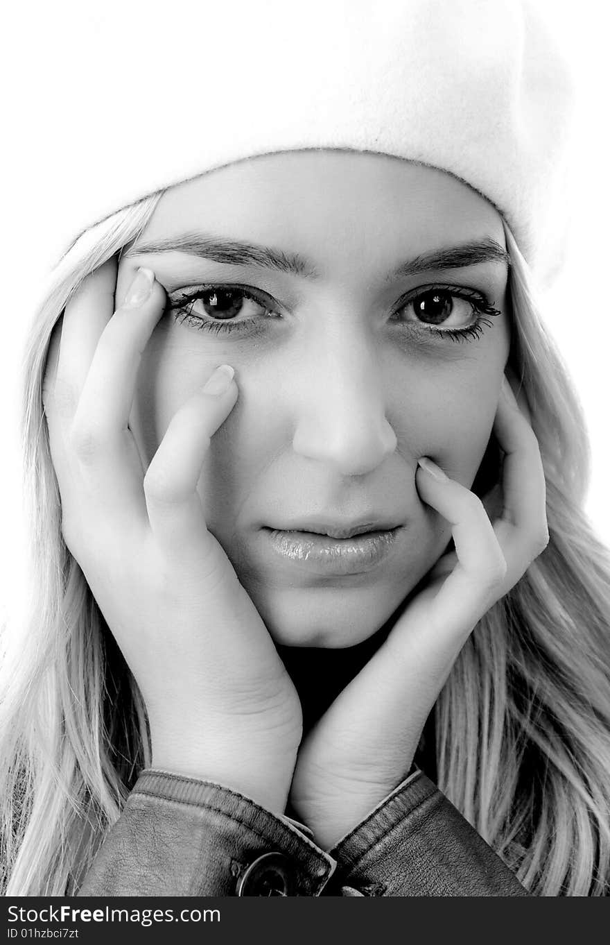 Portrait of young woman holding her face