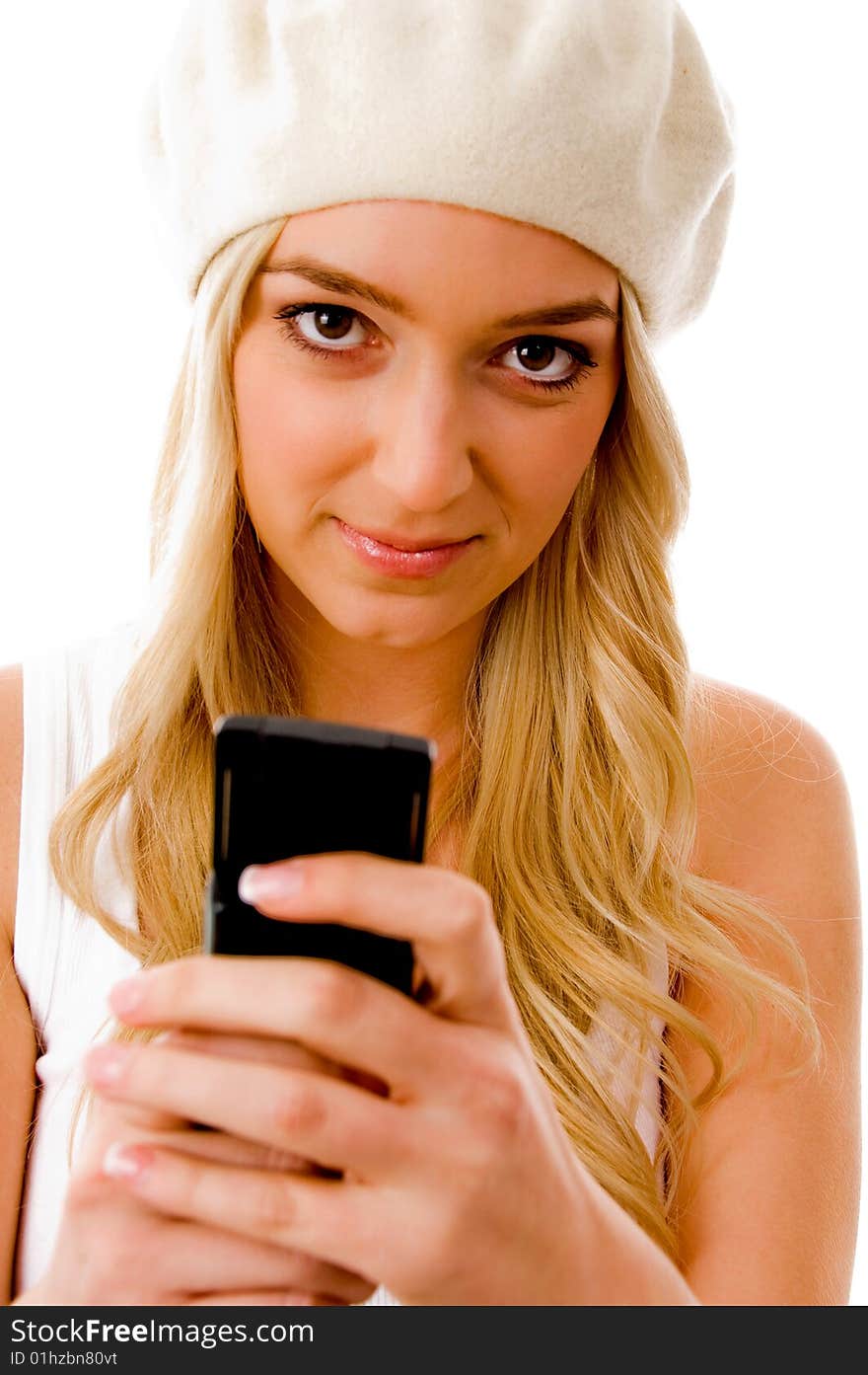 Portrait of smiling young woman holding cell phone on an isolated background