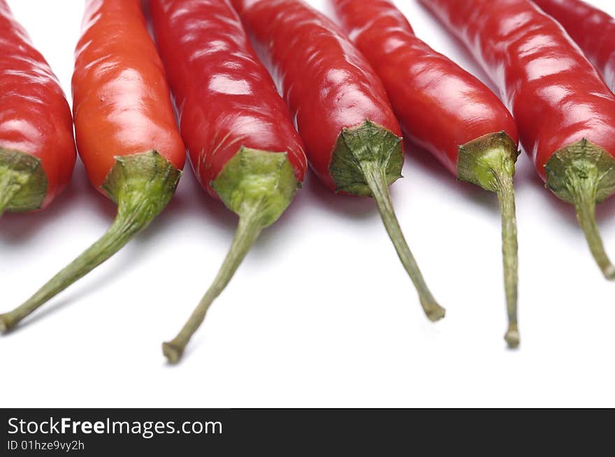 Hot red chili peppers, isolated on white background