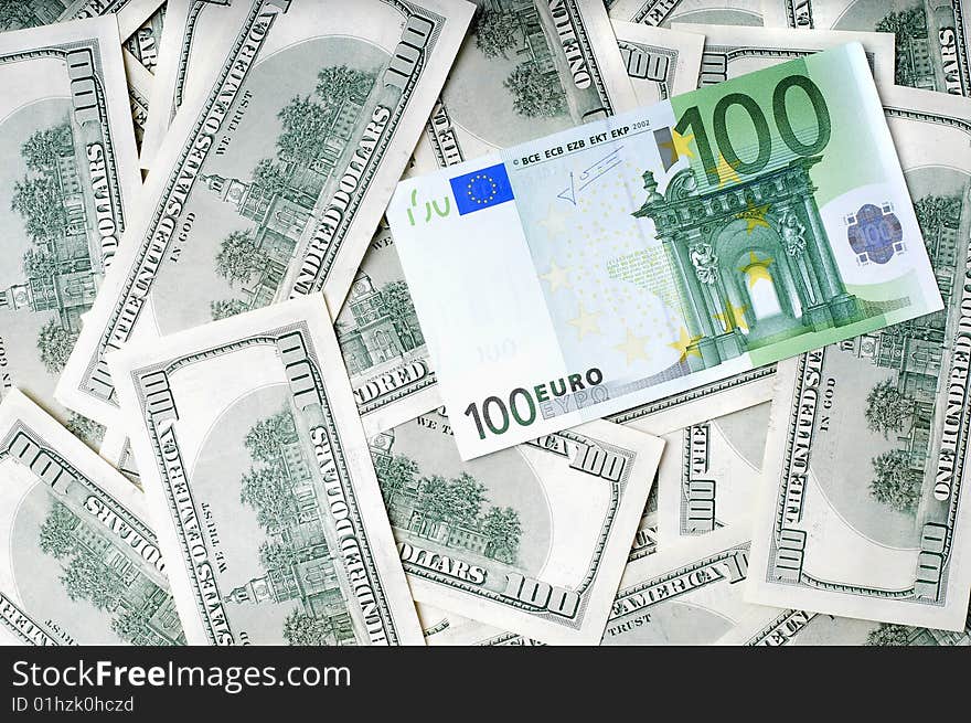 Closeup image of money , lots of 100 US dollar bills and 100 euro