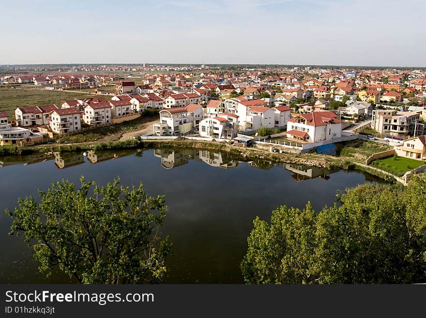 New house district view near a small lake. New house district view near a small lake