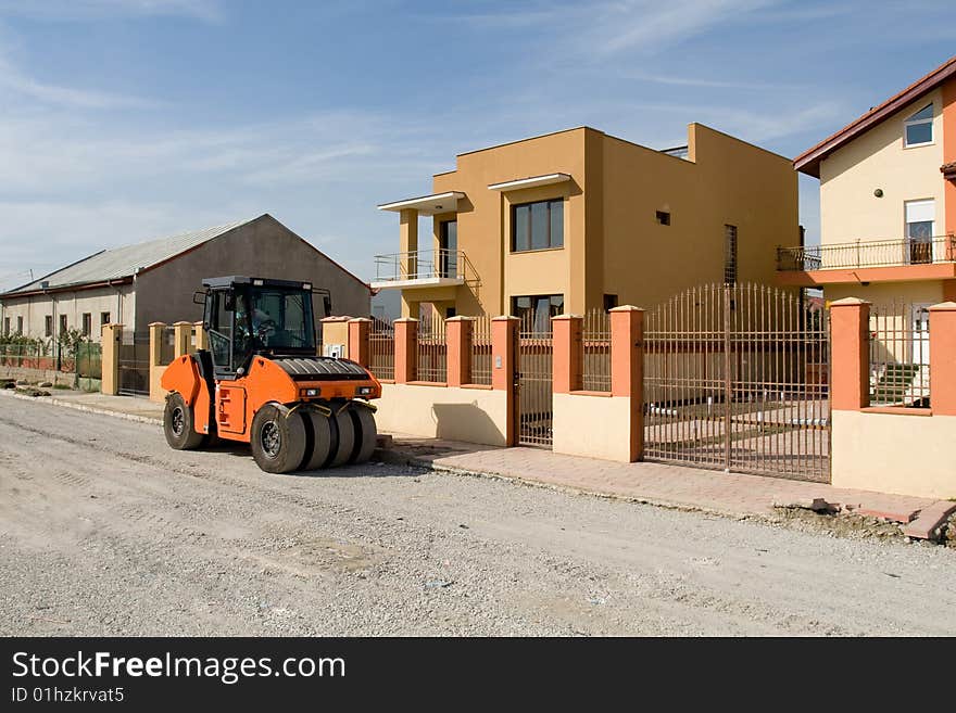 Small bulldozer in action on road construction