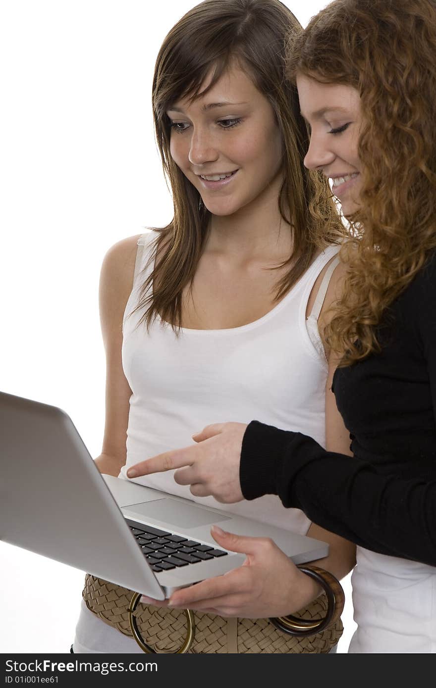 Two teenagers with laptop computer, girls chat on the Internet