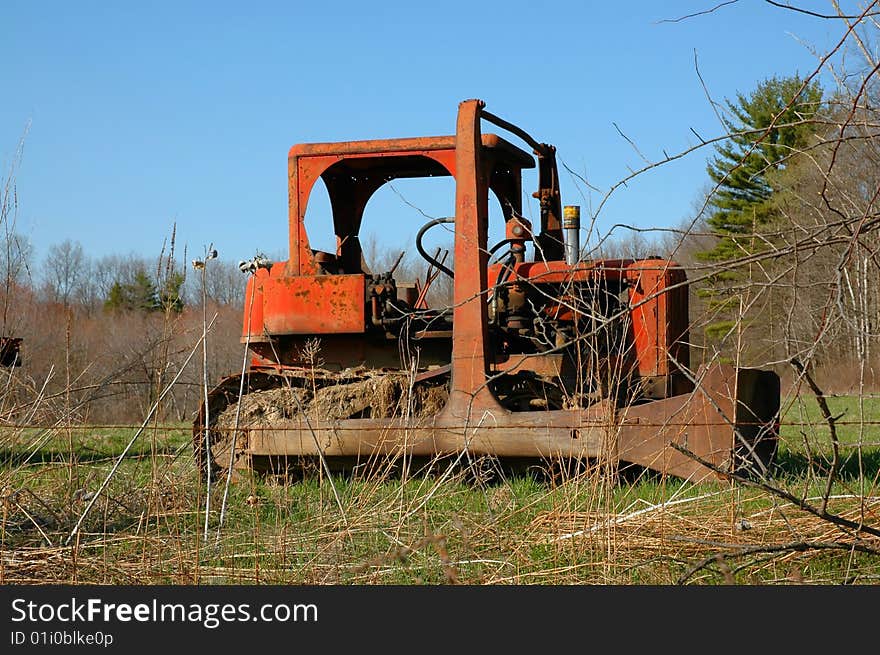 Old farm equipment, antique plow, bob cat. vintage