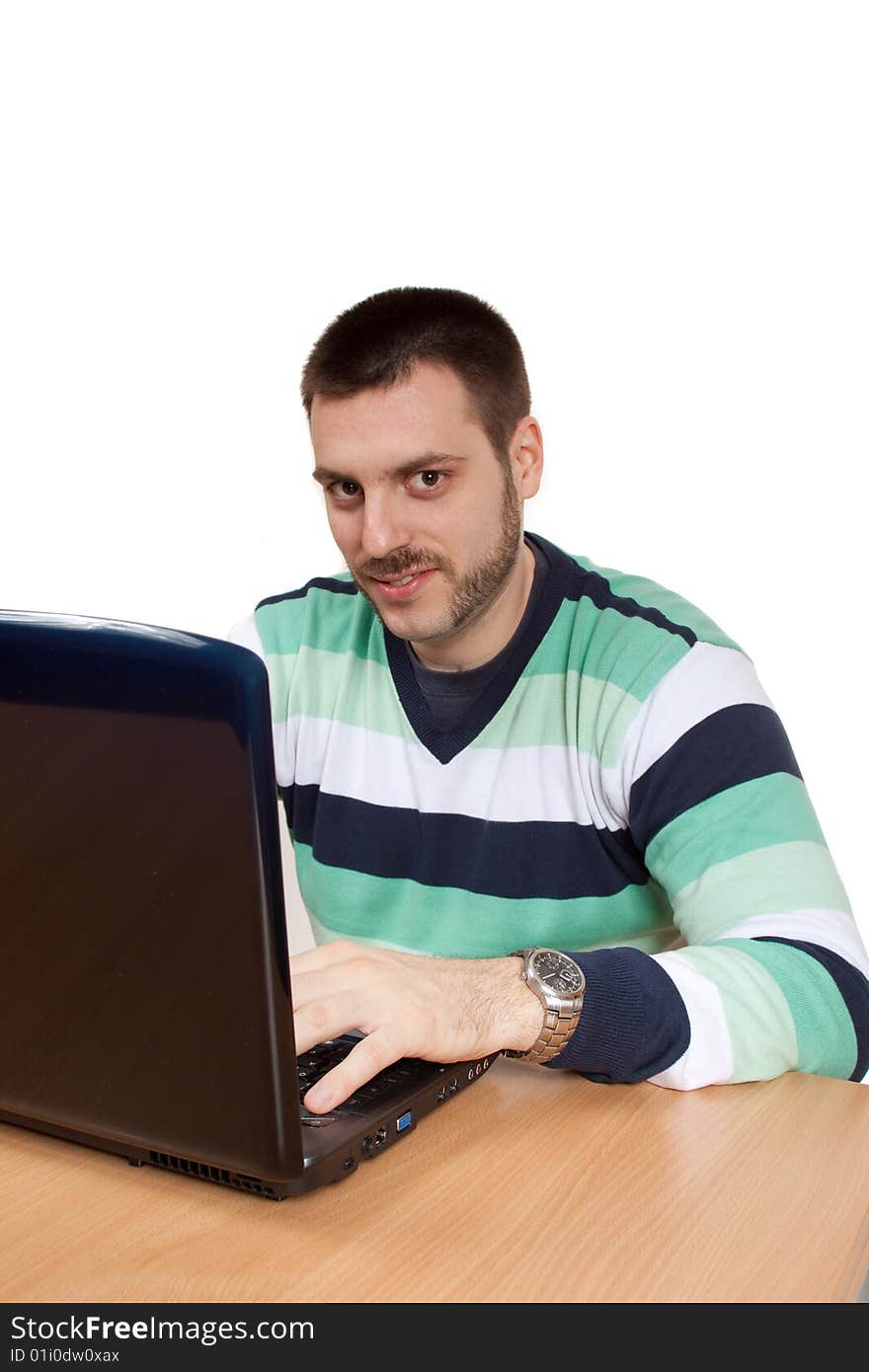 Young man working in front of his notebook. Young man working in front of his notebook