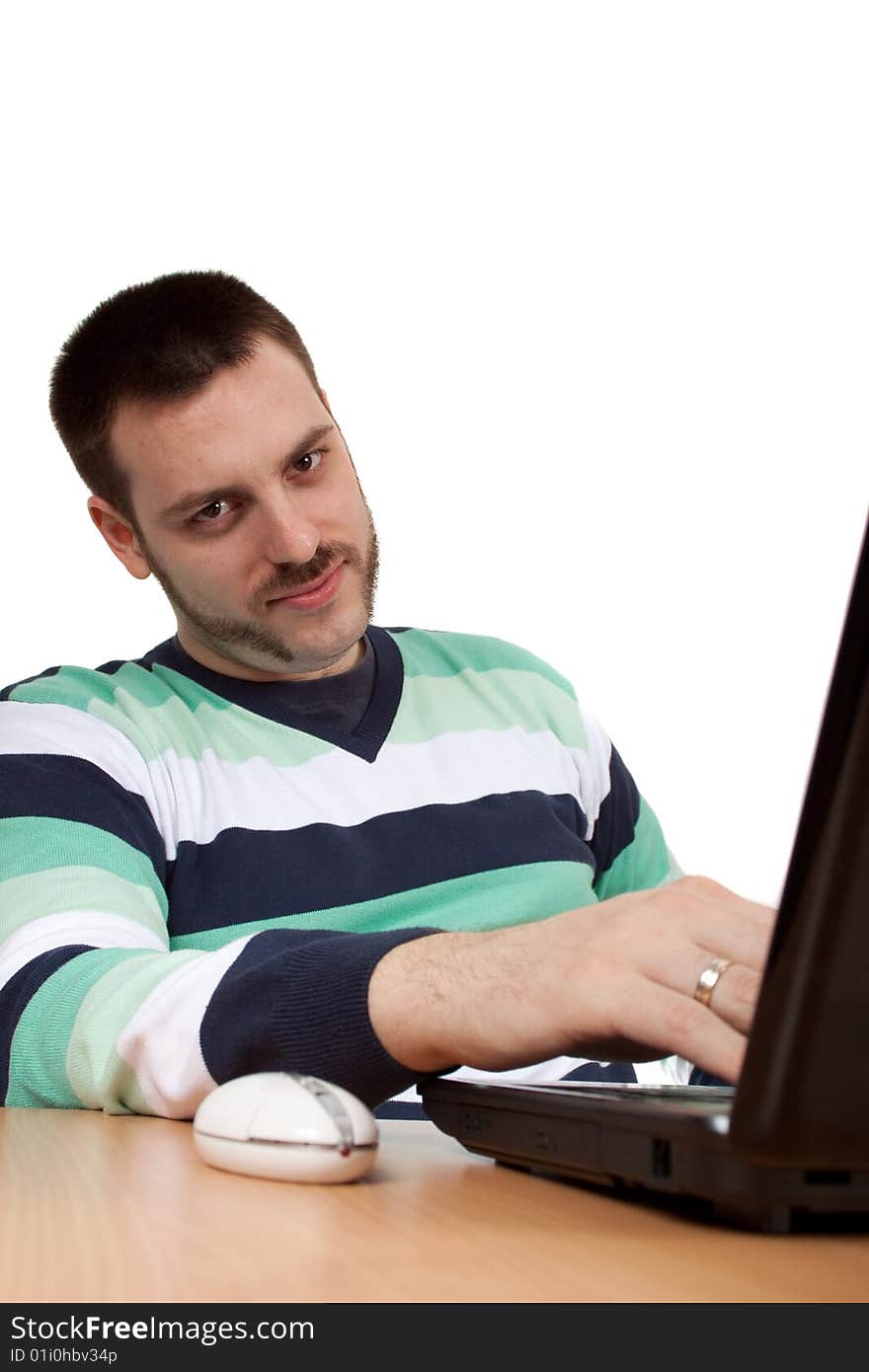 Man chilling on a job in front of his notebook