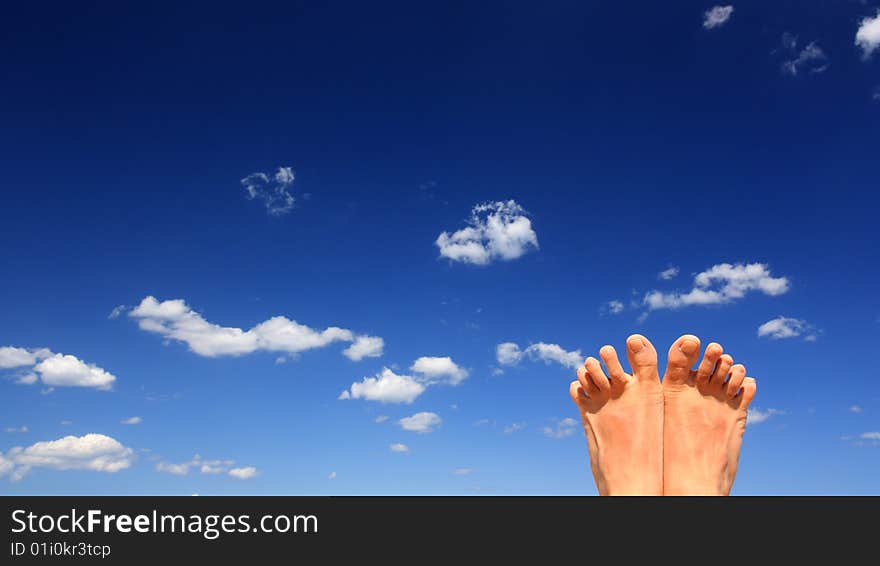 Feet of a young man relaxing on a beach in summer. Location: Italy. Feet of a young man relaxing on a beach in summer. Location: Italy