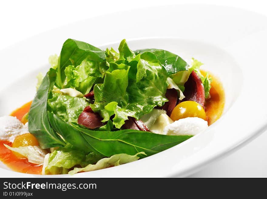 Salad - Smoked Magret (Duck Breast) with Red Chaud-Froid Sauce. Comprises Tomato and Vegetable Leaf. Isolated on White Background. Salad - Smoked Magret (Duck Breast) with Red Chaud-Froid Sauce. Comprises Tomato and Vegetable Leaf. Isolated on White Background