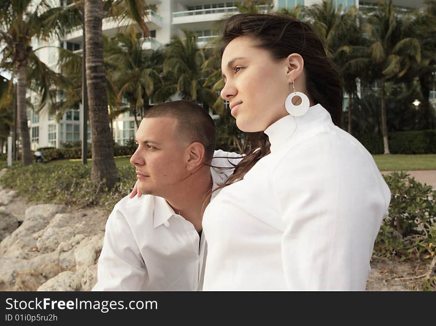 Attractive young couple watching the sunset. Attractive young couple watching the sunset