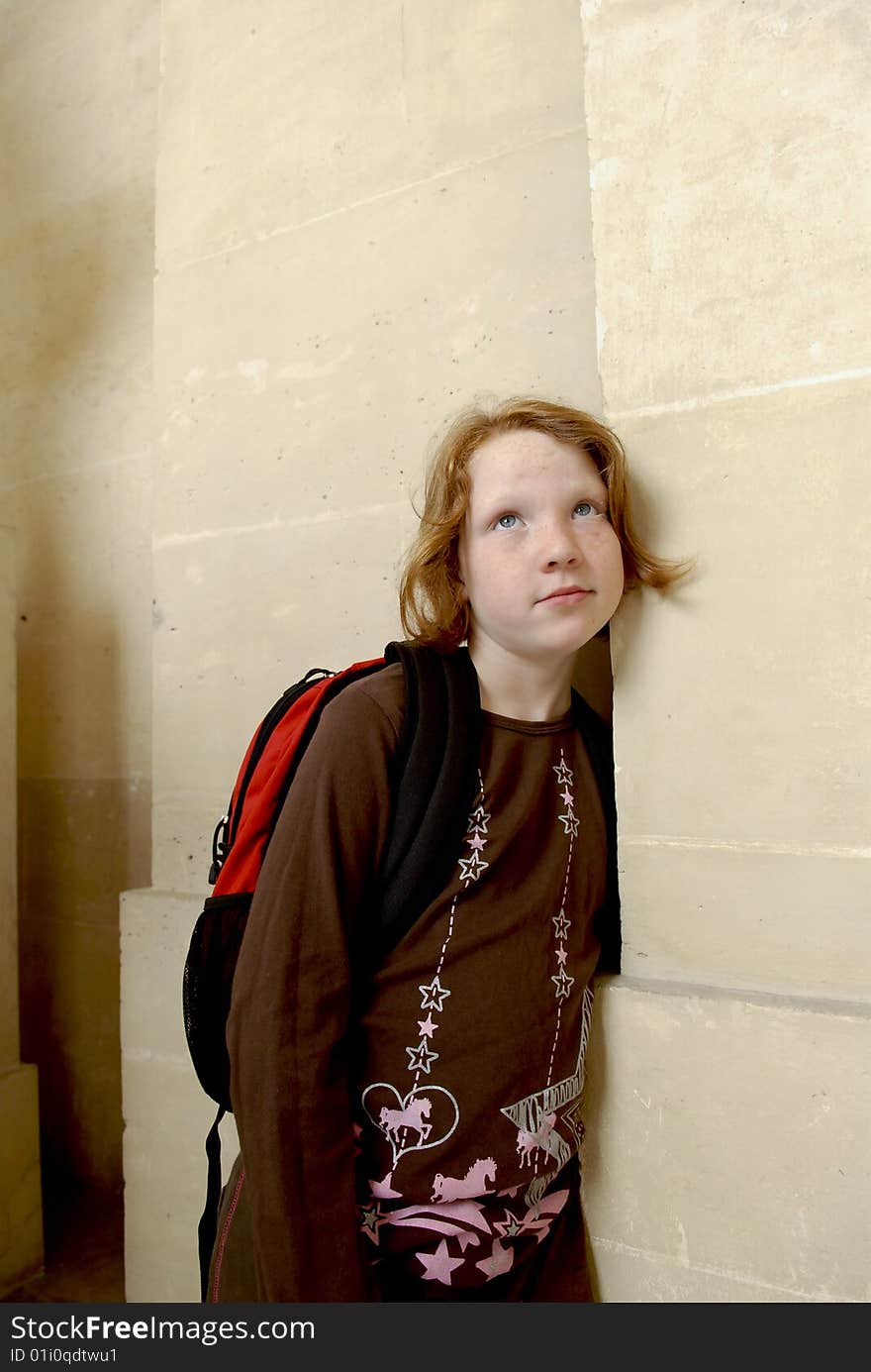 Girl Leans On Wall