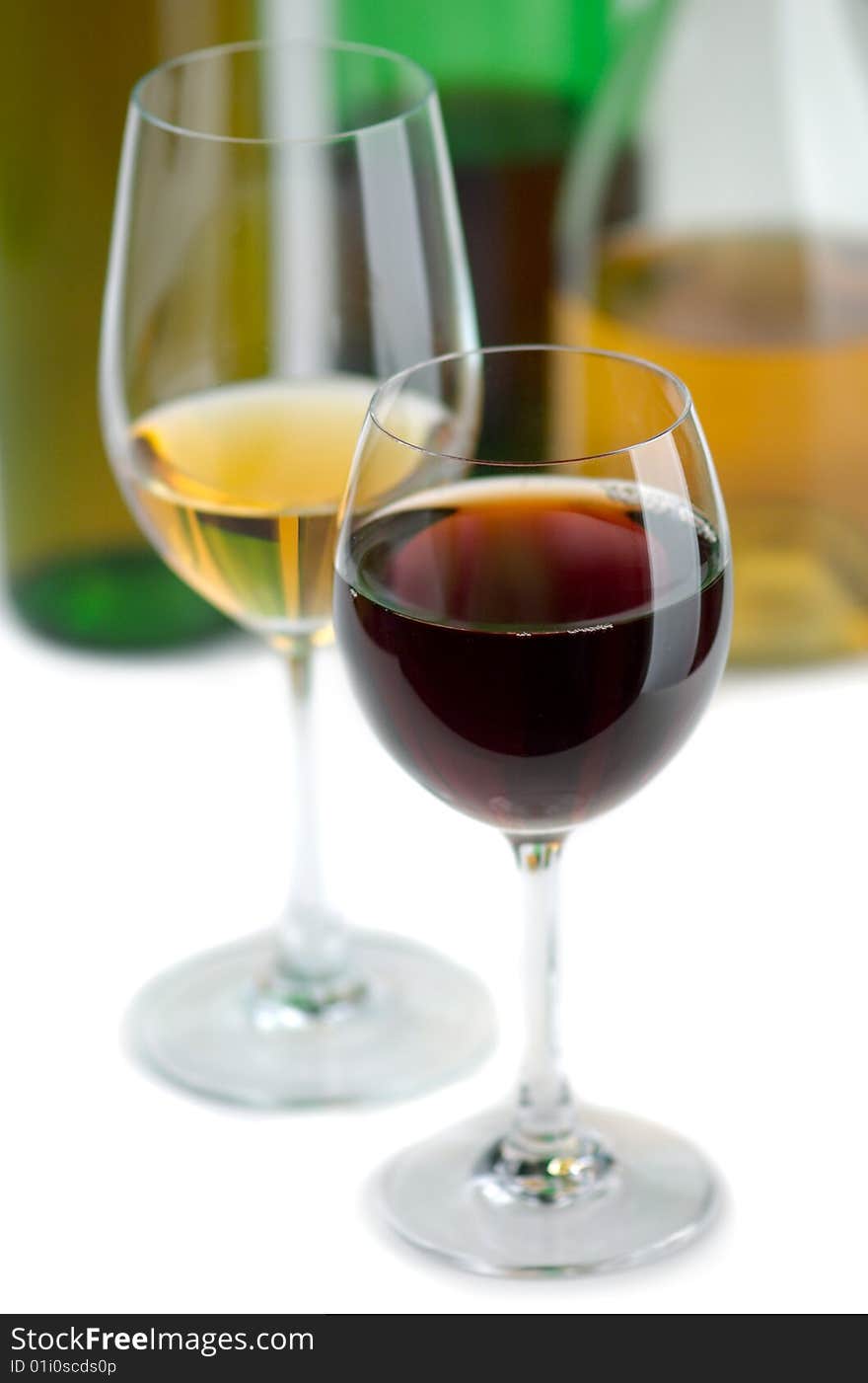 Glasses white and red wine on a white background