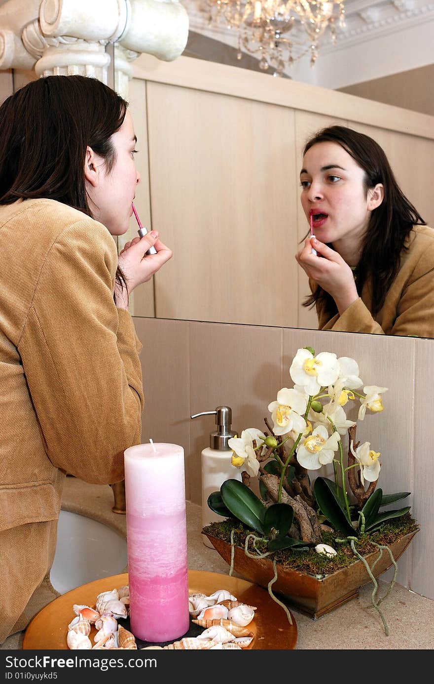 Young Woman In Front Of A Mirror