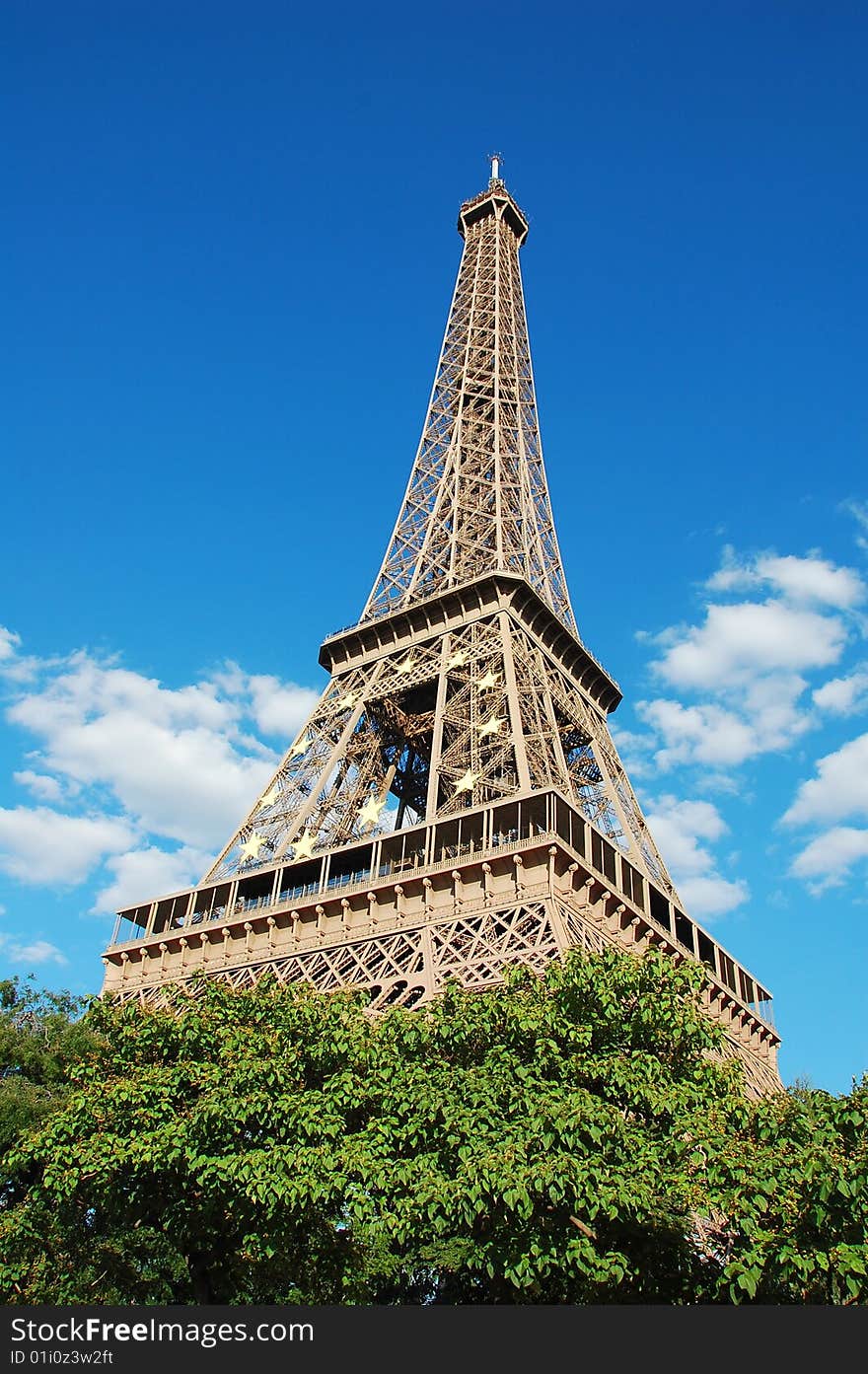 Eiffel Tower in Paris with EU symbol - a circle of twelve golden yellow stars. Eiffel Tower in Paris with EU symbol - a circle of twelve golden yellow stars