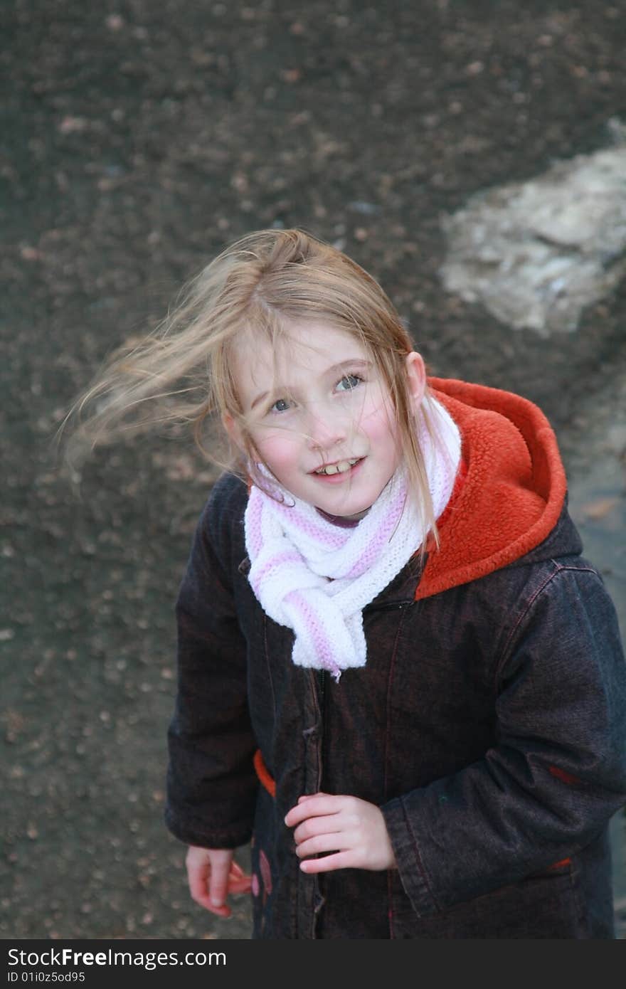 Teenage girl looking up, in winter time