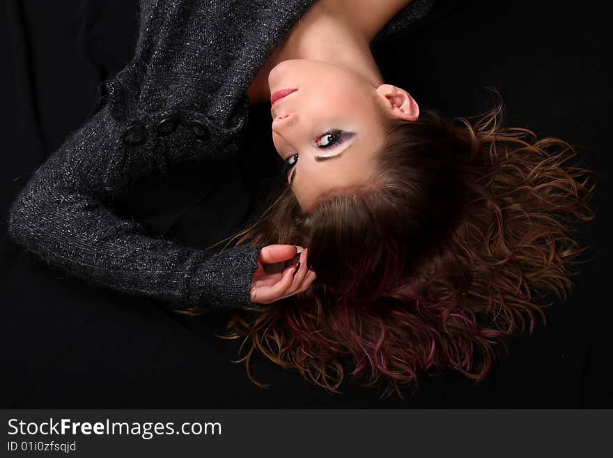 Young woman lying and looking to the camera. Young woman lying and looking to the camera