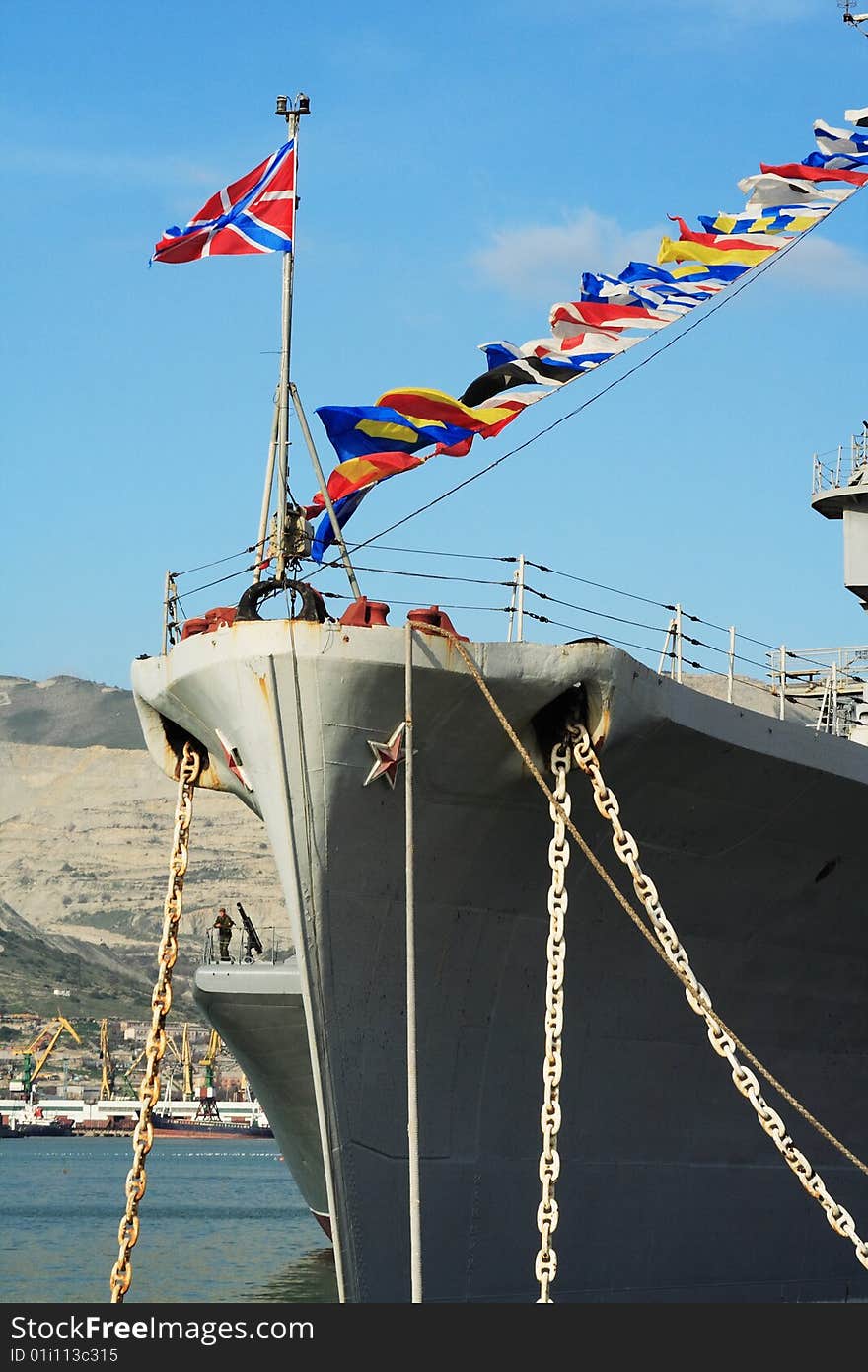 A stern of a battleship anchored in the port. A stern of a battleship anchored in the port