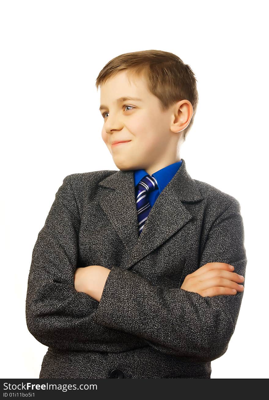 Schoolboy in a gray coat with a blue tie.