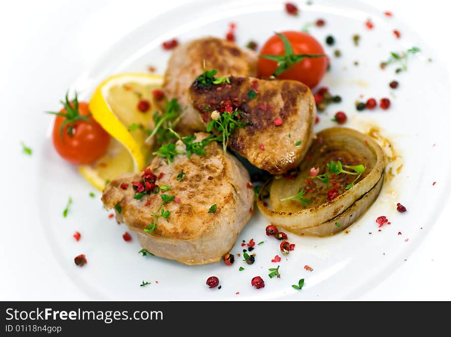 Pork fillet-tenderloin,with baked onion,tomato