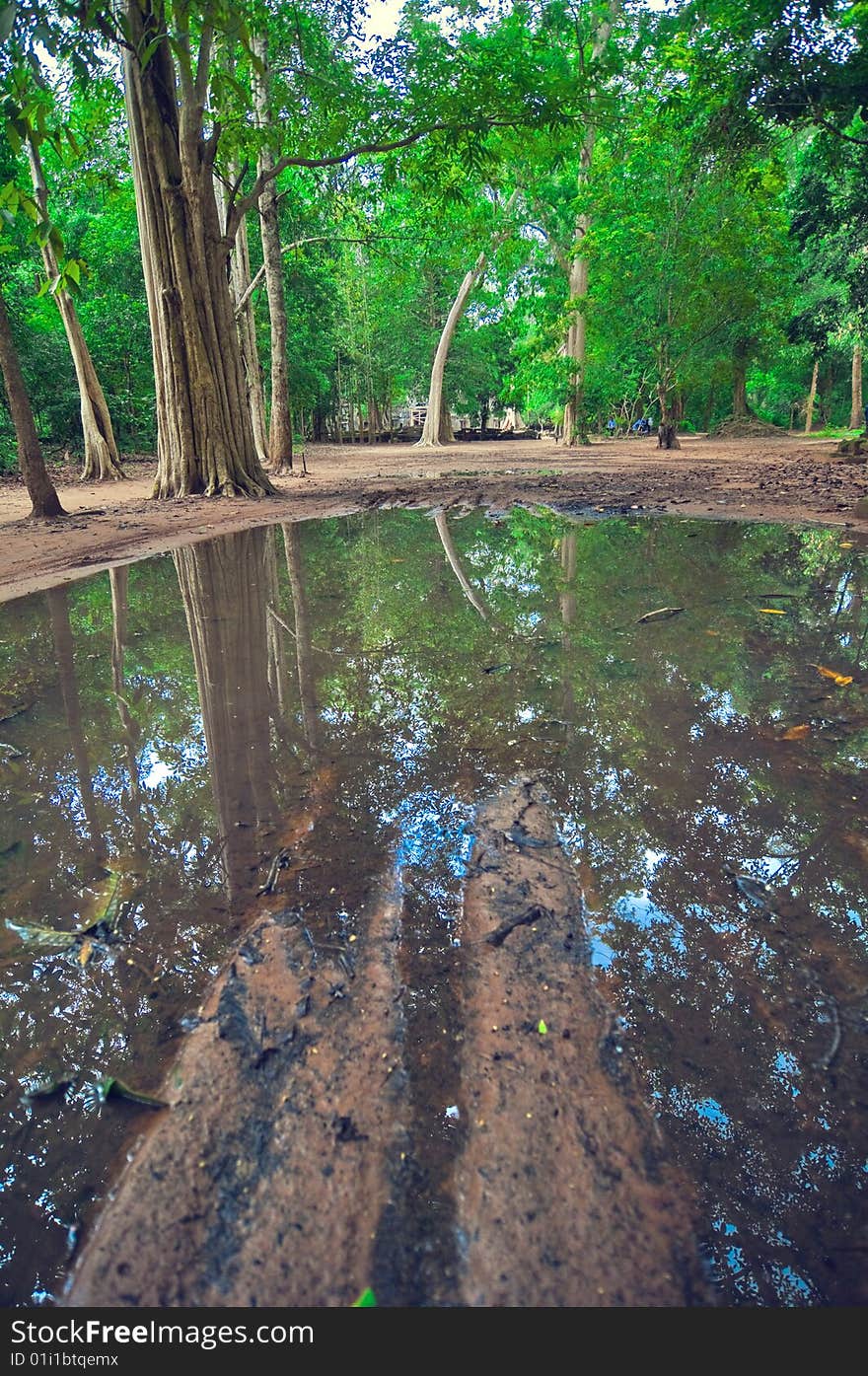 Garden inside view of Angkor Wat. Angkor Wat (or Angkor Vat) is a temple complex at Angkor, Cambodia, built for the king Suryavarman II in the early 12th century as his state temple and capital city. As the best-preserved temple at the site, it is the only one to have remained a significant religious centre since its foundation—first Hindu, dedicated to Vishnu, then Buddhist. The temple is the epitome of the high classical style of Khmer architecture. It has become a symbol of Cambodia, appearing on its national flag, and it is the country's prime attraction for visitors.