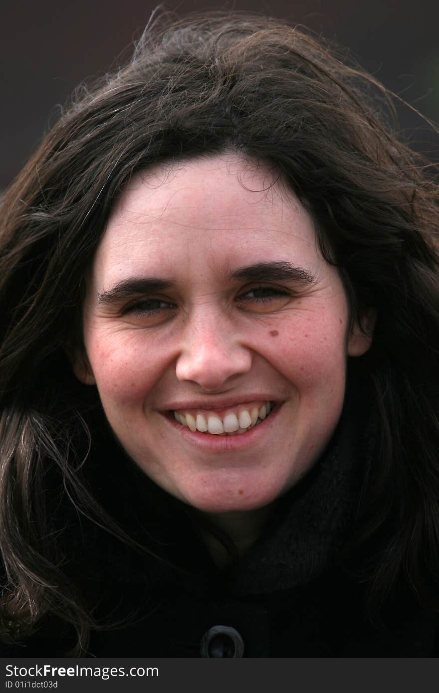 Woman smiling with black background. Woman smiling with black background