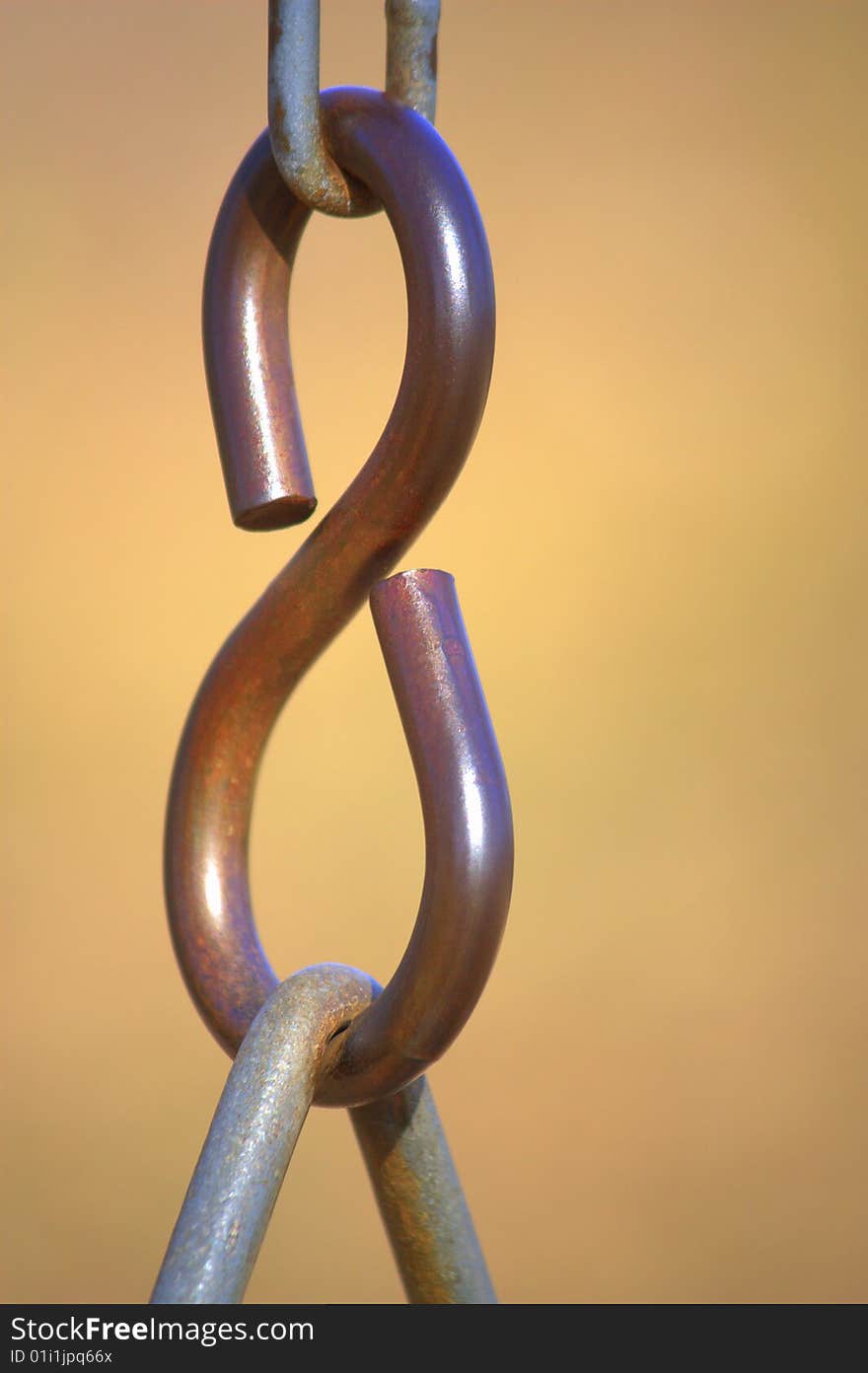 A chain link that holds up a swing.  Easily represents teamwork. A chain link that holds up a swing.  Easily represents teamwork.