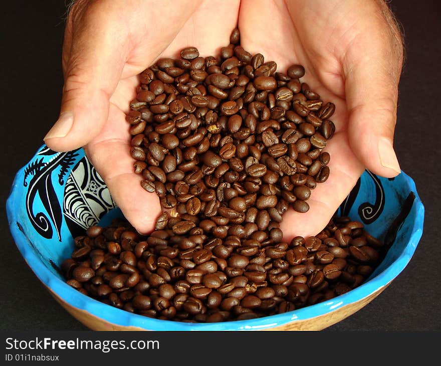 Hands Holding Coffee Beans