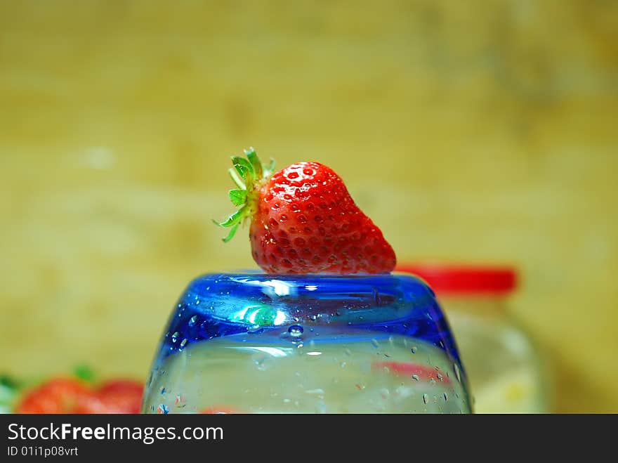 A beautiful strawberry on a glass cup