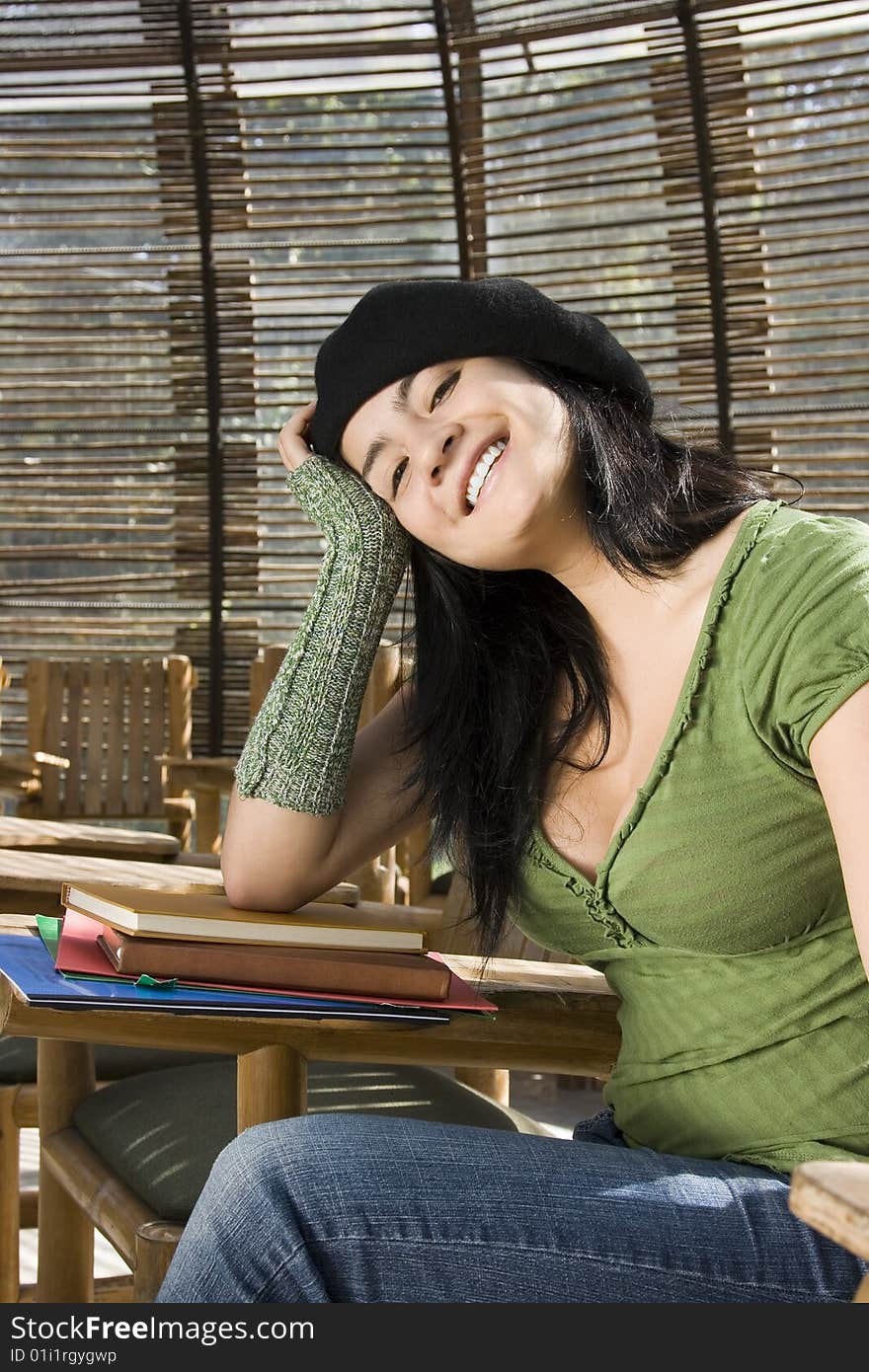 A young female student smiles at the camera. A young female student smiles at the camera.