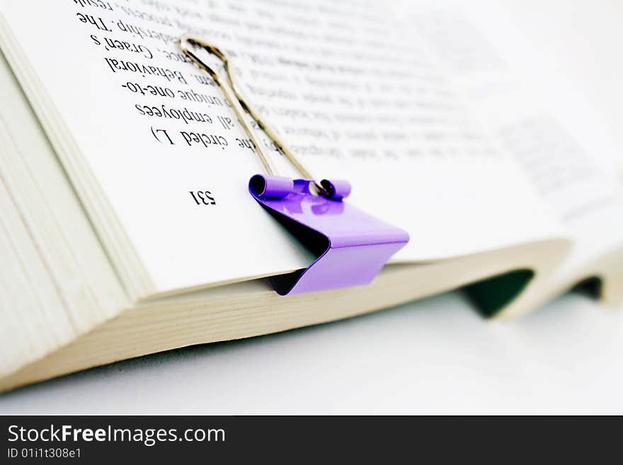 Book with paper clip isolated on white background. Book with paper clip isolated on white background