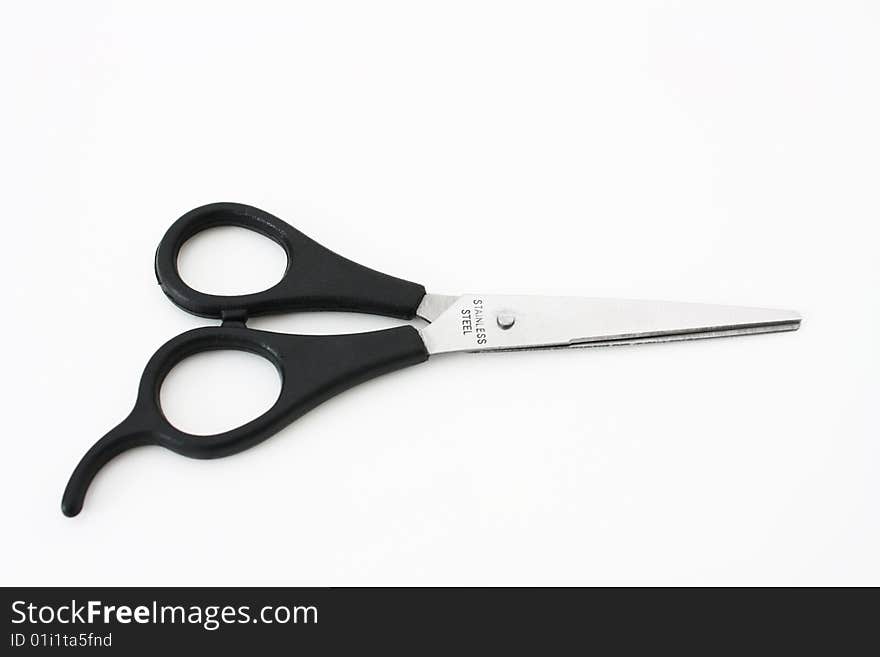 Black scissors isolated on white background