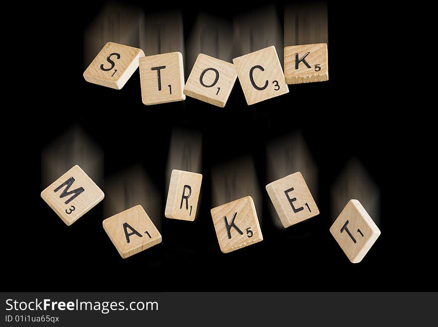 Falling scrabble pieces spelling the words Stock Market. Falling scrabble pieces spelling the words Stock Market