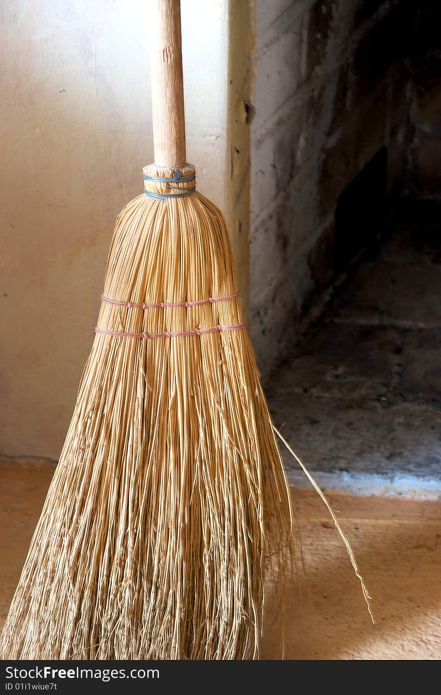 A close-up of an old straw broom. A close-up of an old straw broom