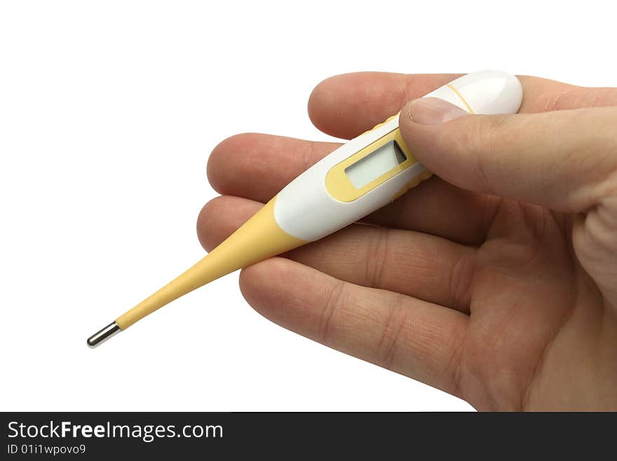 The digital thermometer in a hand on a white background is isolated