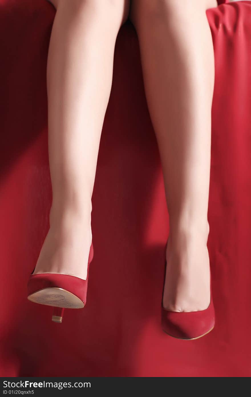 Fine female legs in red shoes. Fine female legs in red shoes