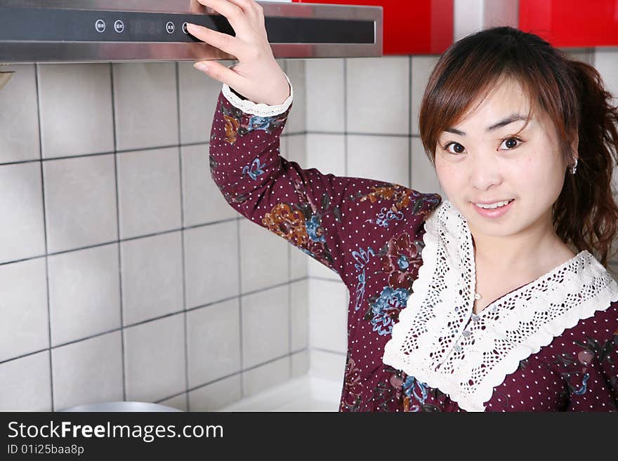 Young asia girl at kitchen