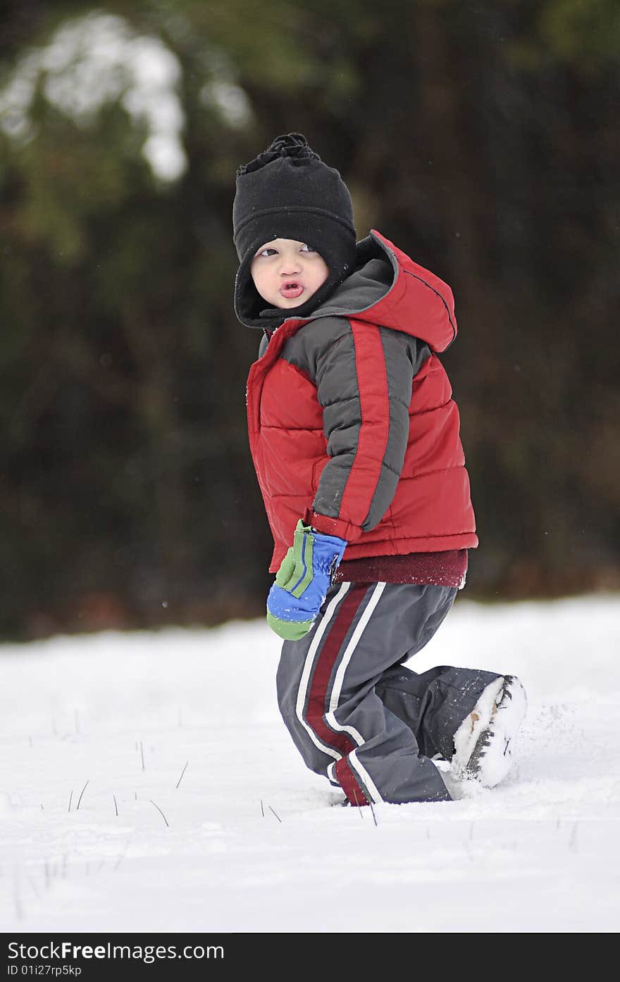 Little boy running in the snow. Little boy running in the snow