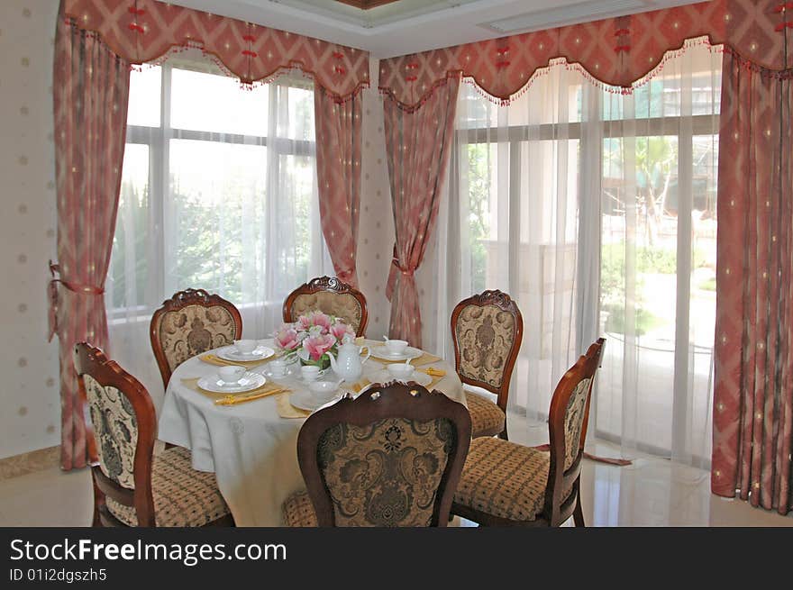 It is interior of apartment, it is the dining room.