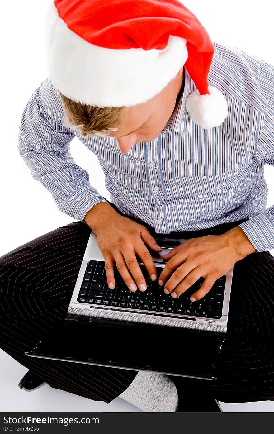 Male working on notebook against white background