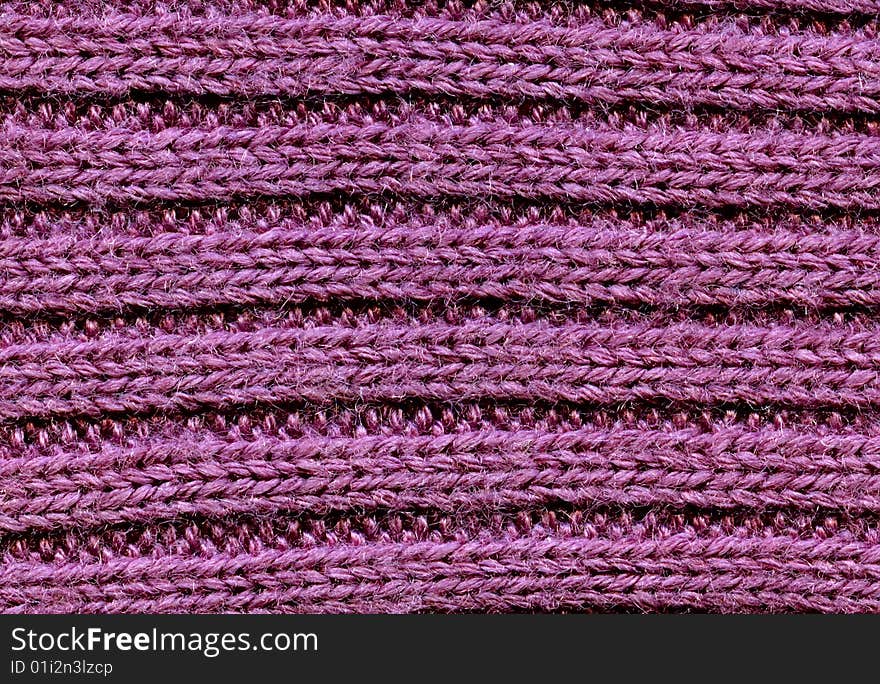 Abstract textural violet background from a piece of a wool.