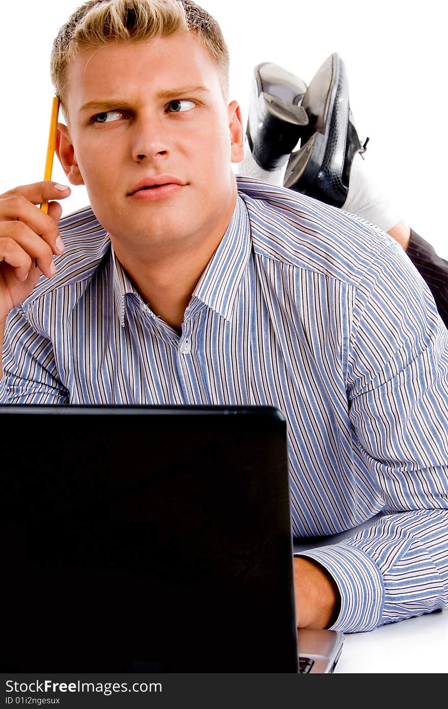 Thinking man with laptop and pencil against white background